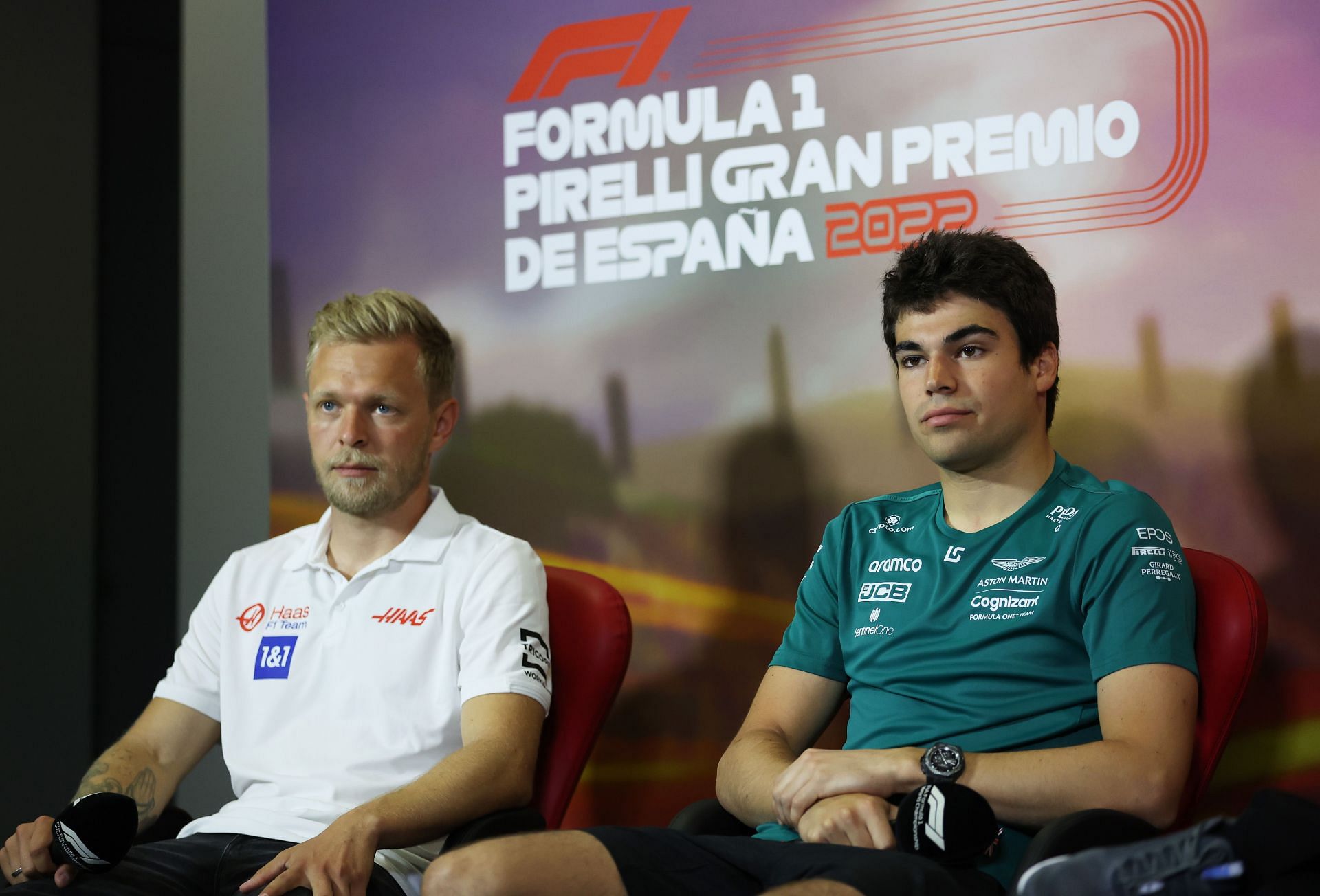 Haas F1 driver Kevin Magnussen (left) and Aston Martin F1 driver Lance Stroll (right) during the 2022 F1 Spanish GP pre-race press conference (Photo by Bryn Lennon/Getty Images)