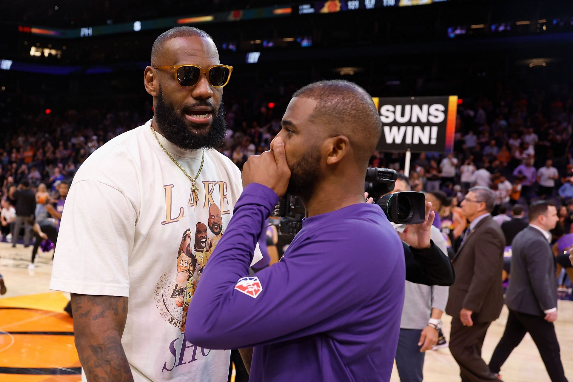LeBron James (left) of the LA Lakers talks with Chris Paul of the Phoenix Suns following an NBA game on April 05, 2022, in Phoenix, Arizona.