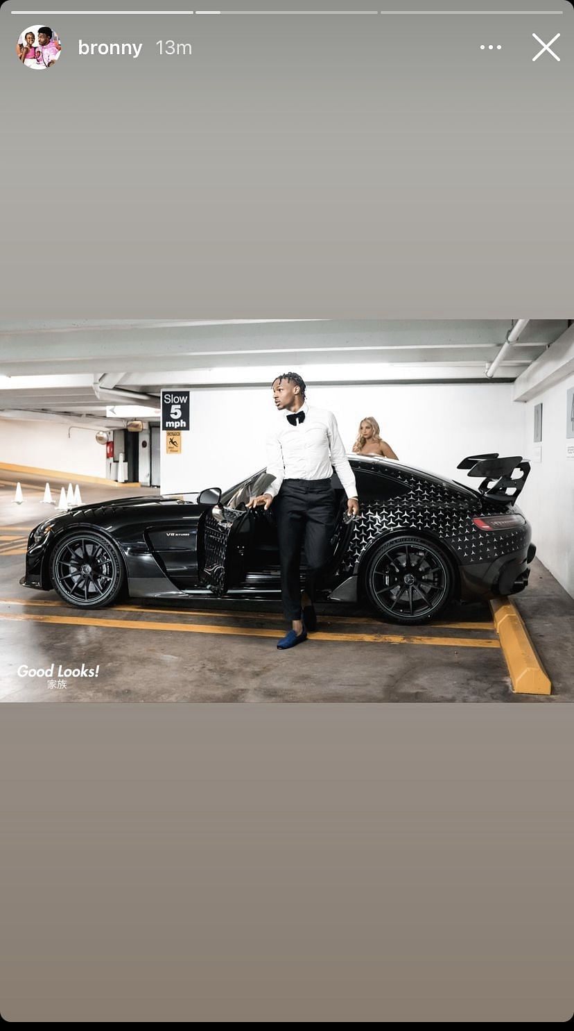 The 17-year-old posing with his date in front of his ride. Source: Bronny&#039;s Instagram