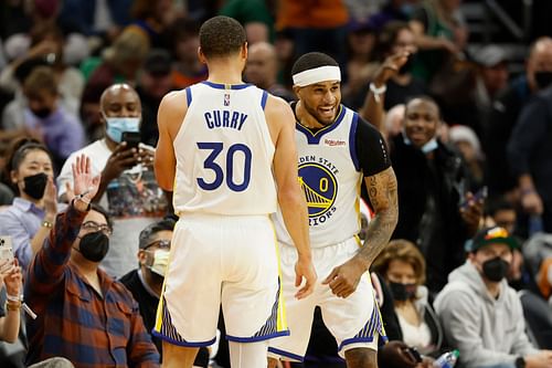 Gary Payton II and Steph Curry during a regular season match up with the Phoenix Suns.