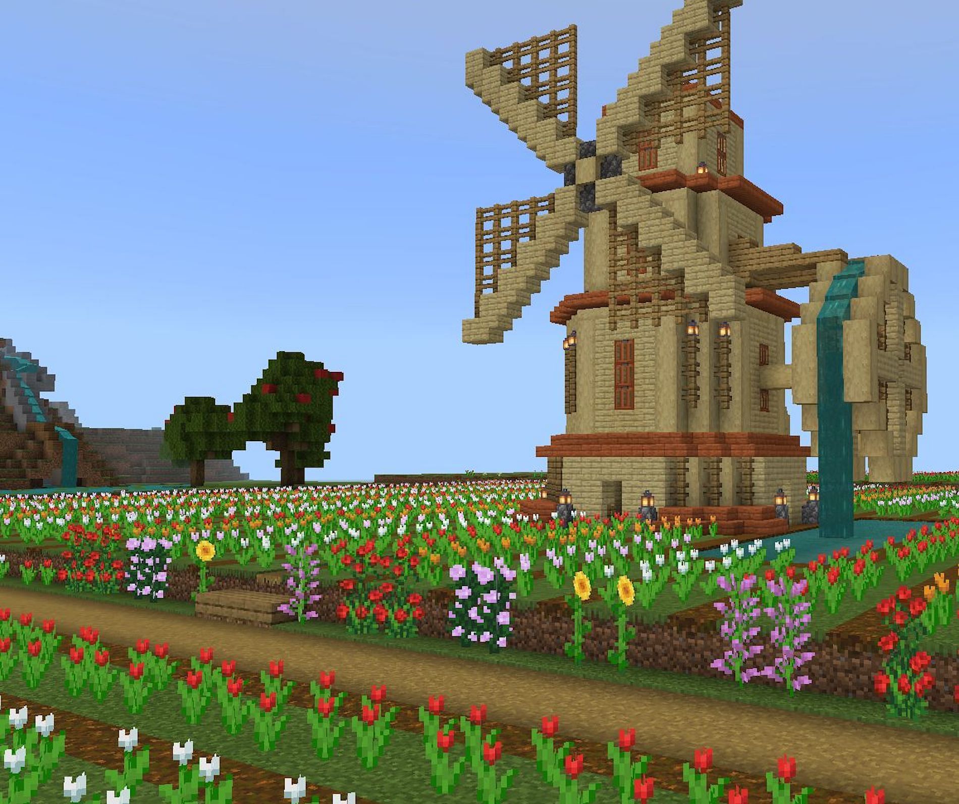 Flowery windmill garden design (Image via ᜊﬞﬞ ⚘ ash&lrm;・ࡇ・/ Pinterest)