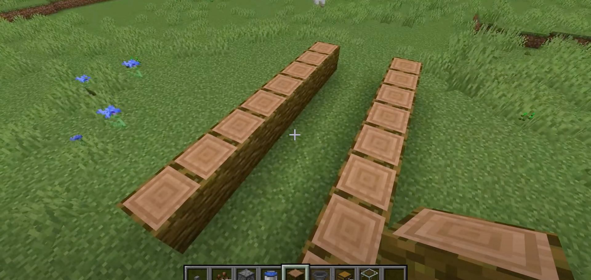 Minecraft players need to place 2 rows of jungle logs (Image via NaMiature/YouTube)
