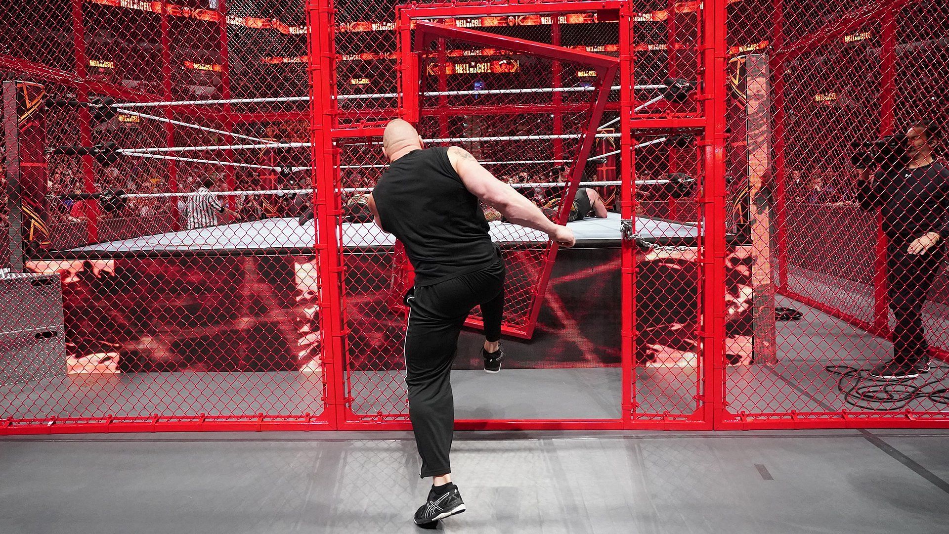 Brock Lesnar in the midst of kicking the Hell in a Cell door down/credit WWE