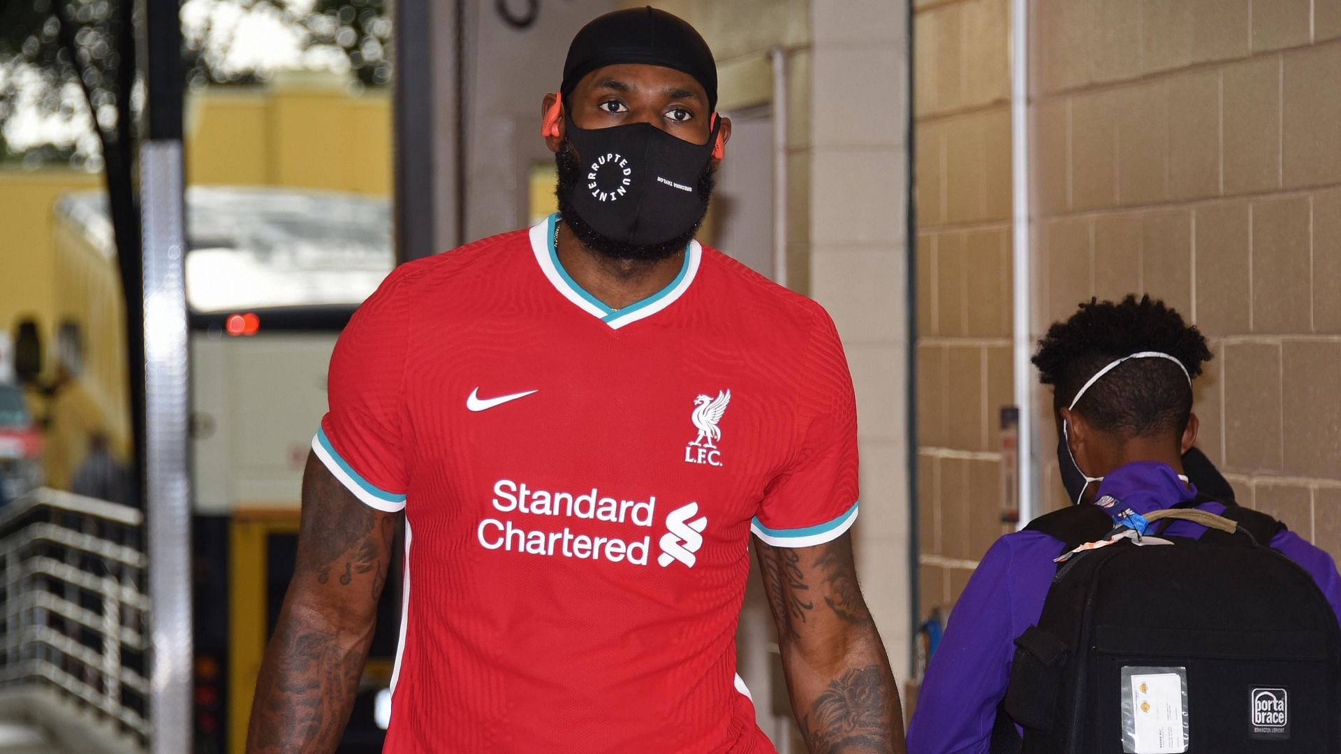 LeBron &quot;King&quot; James arrives for an LA Lakers game wearing the Liverpool FC home kit