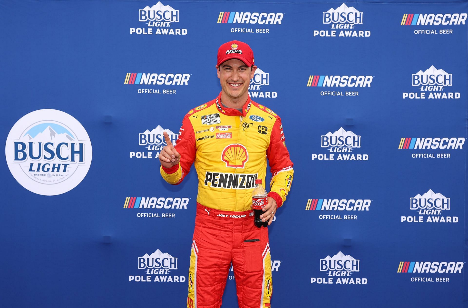 Joey Logano poses for photos after winning the pole award during qualifying for the NASCAR Cup Series Goodyear 400 at Darlington Raceway (Photo by James Gilbert/Getty Images)