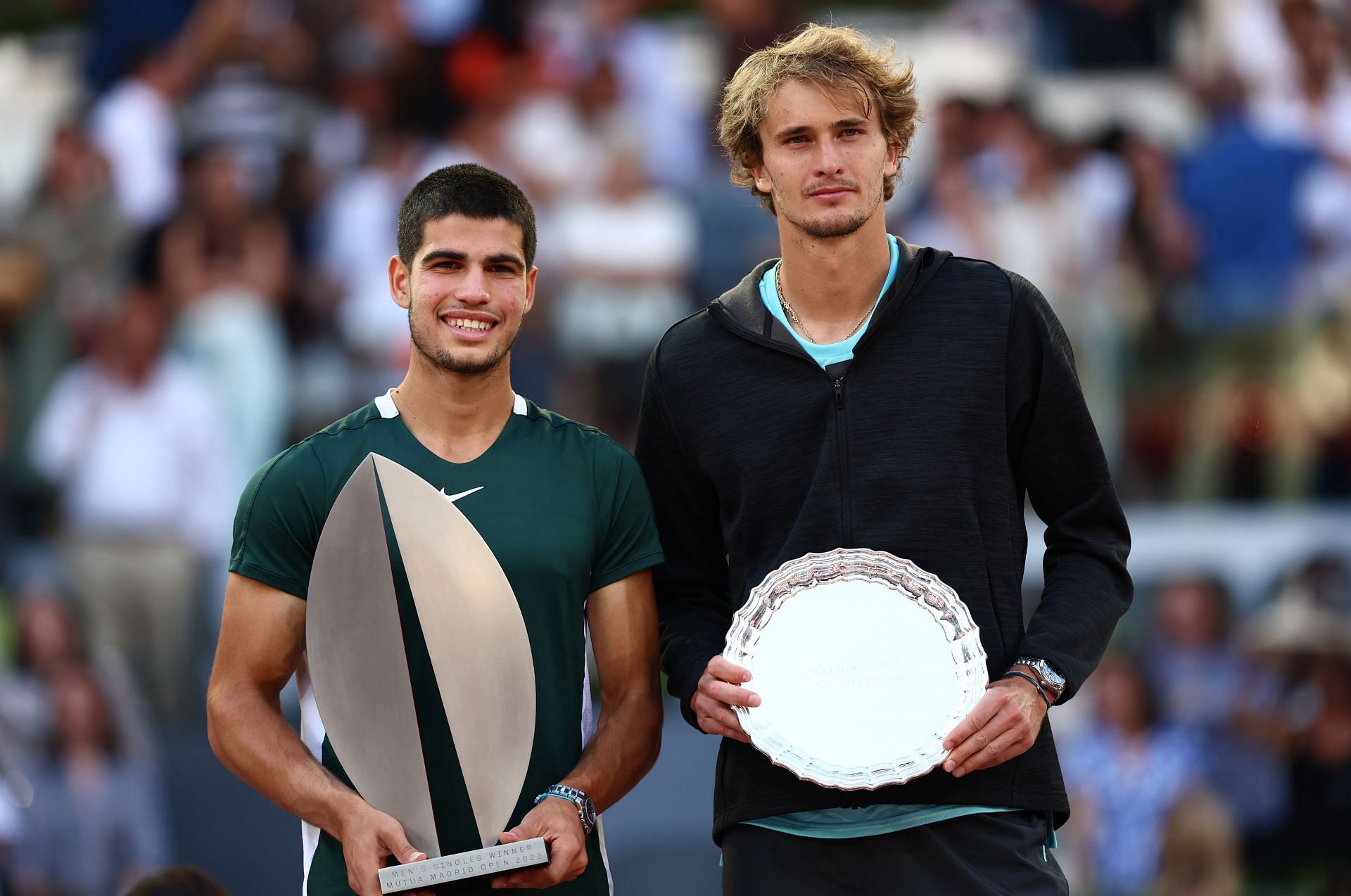 Carlos Alcaraz (left) is all smiles after winning the Madrid title.