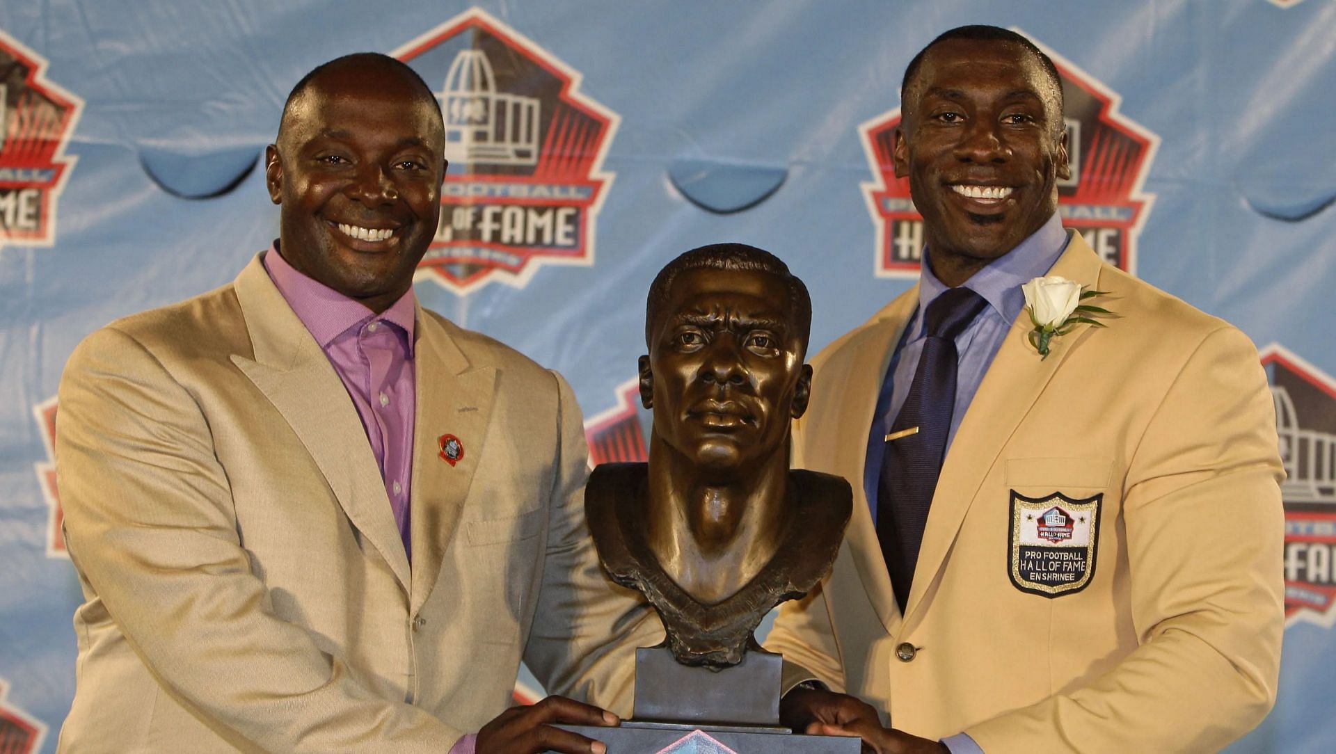Sterling Sharpe (r) with his brother Shannon Shannon (l) at his HOF ceremony in 2011. Source: USA Today