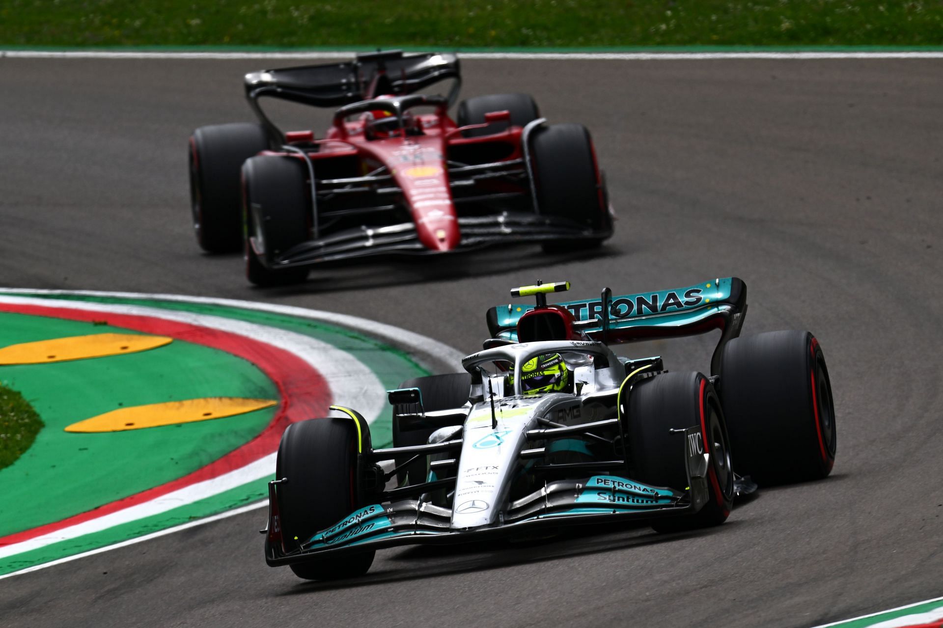 Mercedes&#039; Lewis Hamilton (foreground) being followed by Ferrari&#039;s Charles Leclerc (background) during the 2022 F1 Imola GP weekend (Photo by Clive Mason/Getty Images)