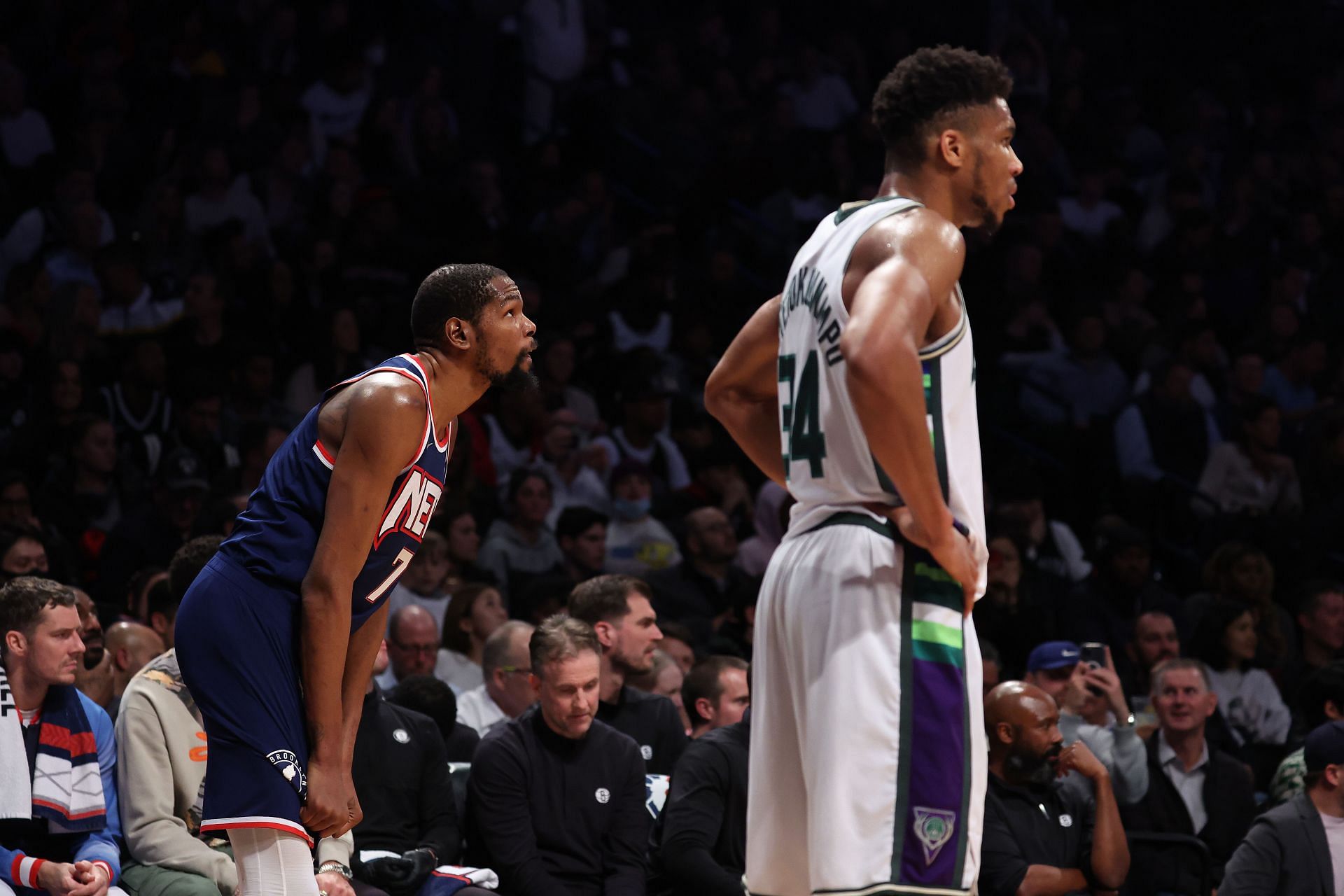 Kevin Durant #7 of the Brooklyn Nets and Giannis Antetokounmpo #34 of the Milwaukee Bucks look on during their game at Barclays Center on March 31, 2022 in New York City.