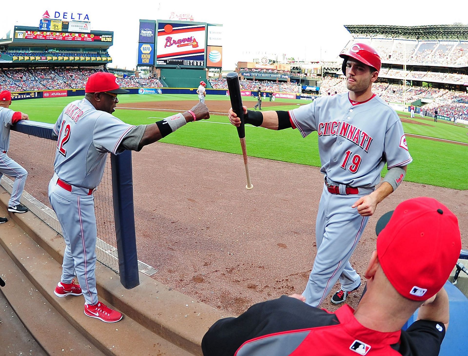 Dusty Baker (left) and Joey Votto (right) during a Cincinnati Reds v Atlanta Braves game in 2013.