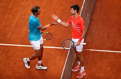 Rafael Nadal and Novak Djokovic shake hands after their match at the 2019 Italian Open