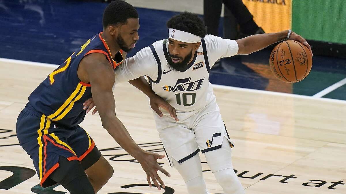 Andrew Wiggins of Golden State and Mike Conley of Utah (Photo: SF Chronicle)