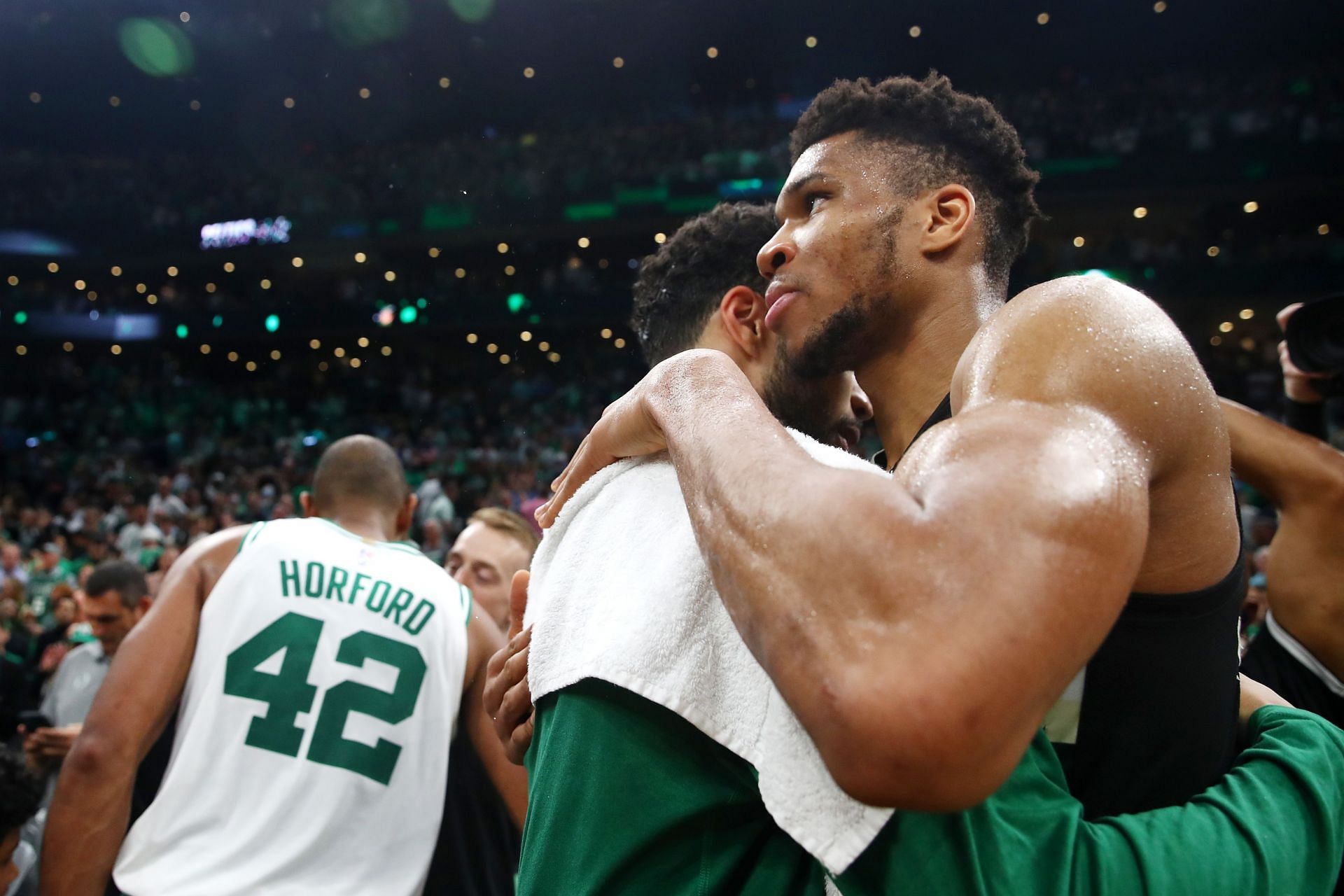 Giannis Antetokounmpo and Jayson Tatum hug after the Boston Celtics&#039; win in Game 7