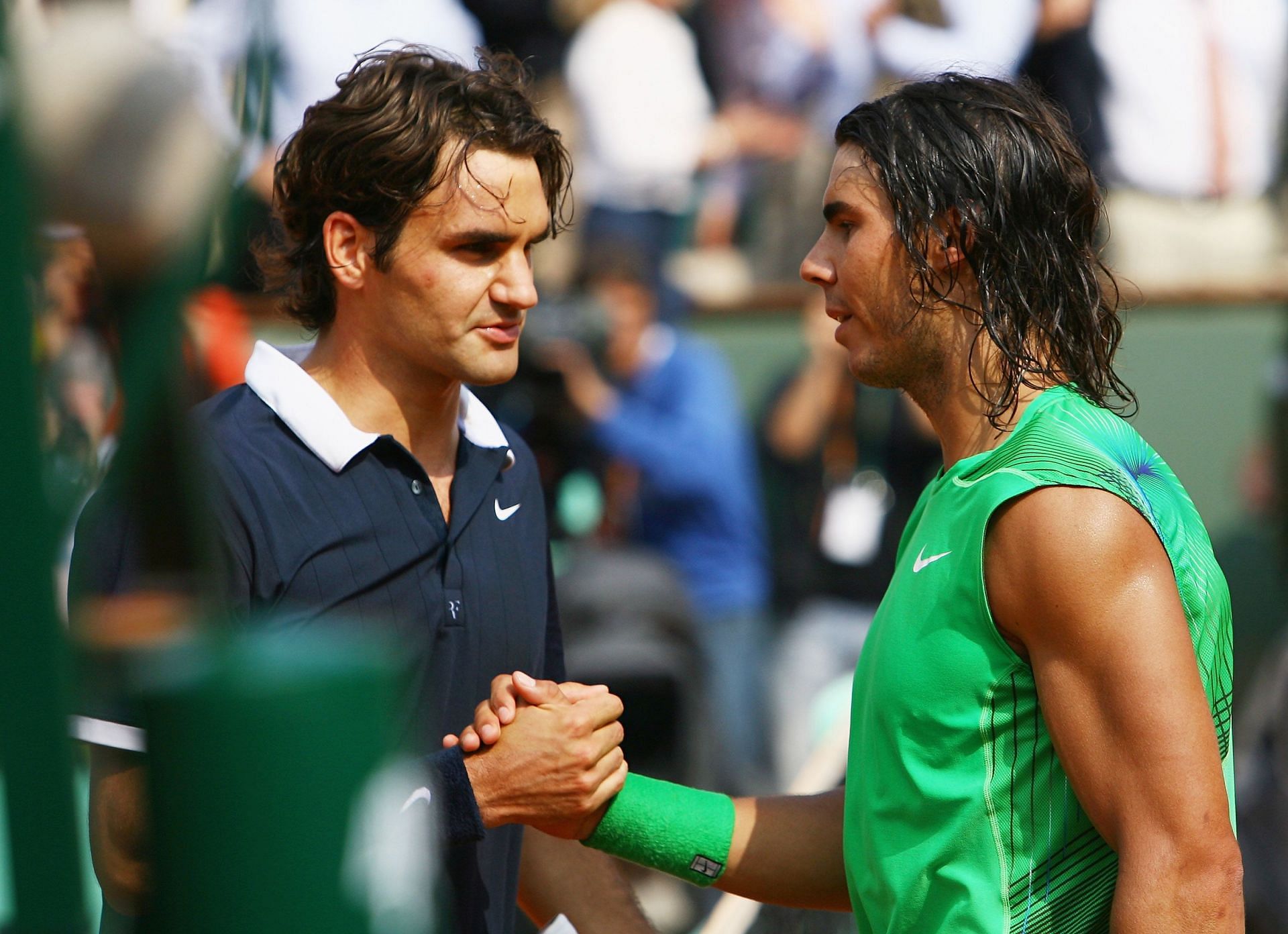 Roger Federer and Rafael Nadal shake hands following the 2008 Roland Garros final