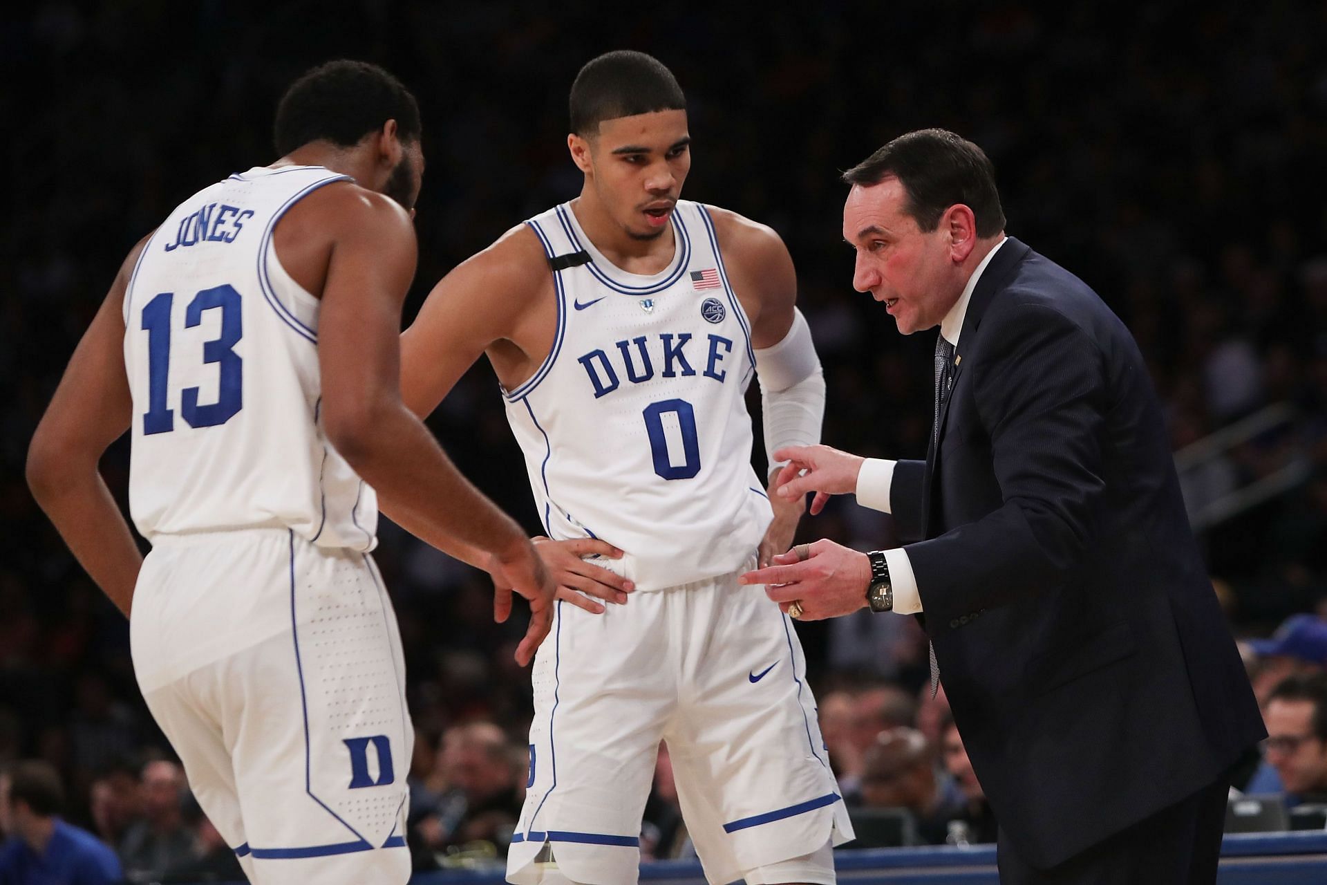 Jayson Tatum getting instructions from Coach K