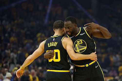 Steph Curry celebrates a play with Draymond Green