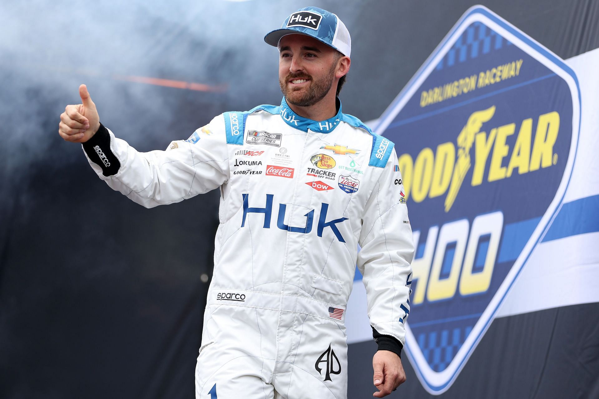 Austin Dillon gives a thumbs up to fans as he walks on stage during driver intros before the NASCAR Cup Series Goodyear 400 at Darlington Raceway (Photo by James Gilbert/Getty Images)