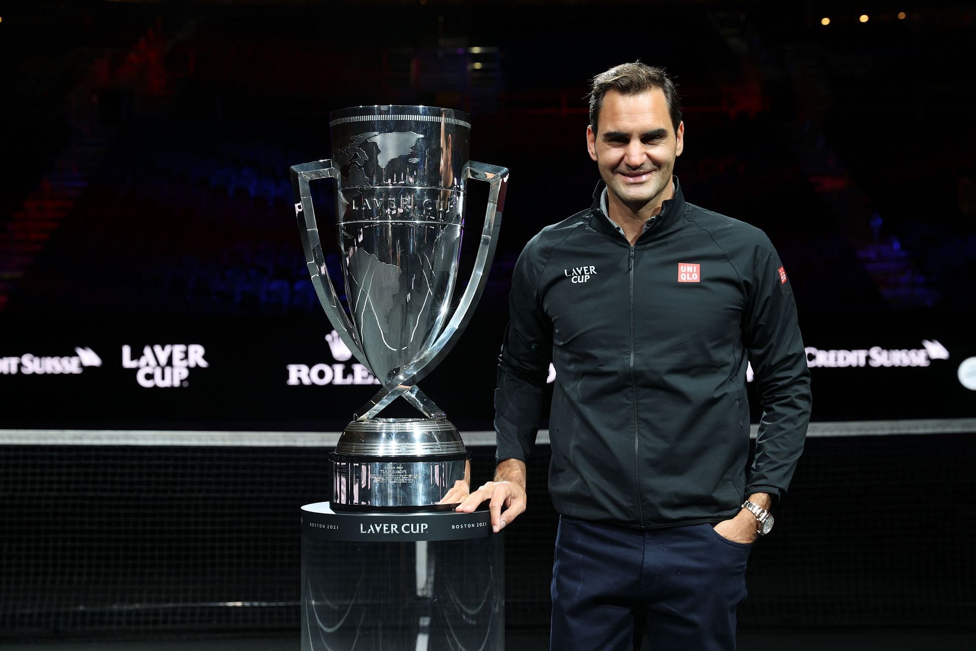 Roger Federer poses alongside the Laver Cup in 2021