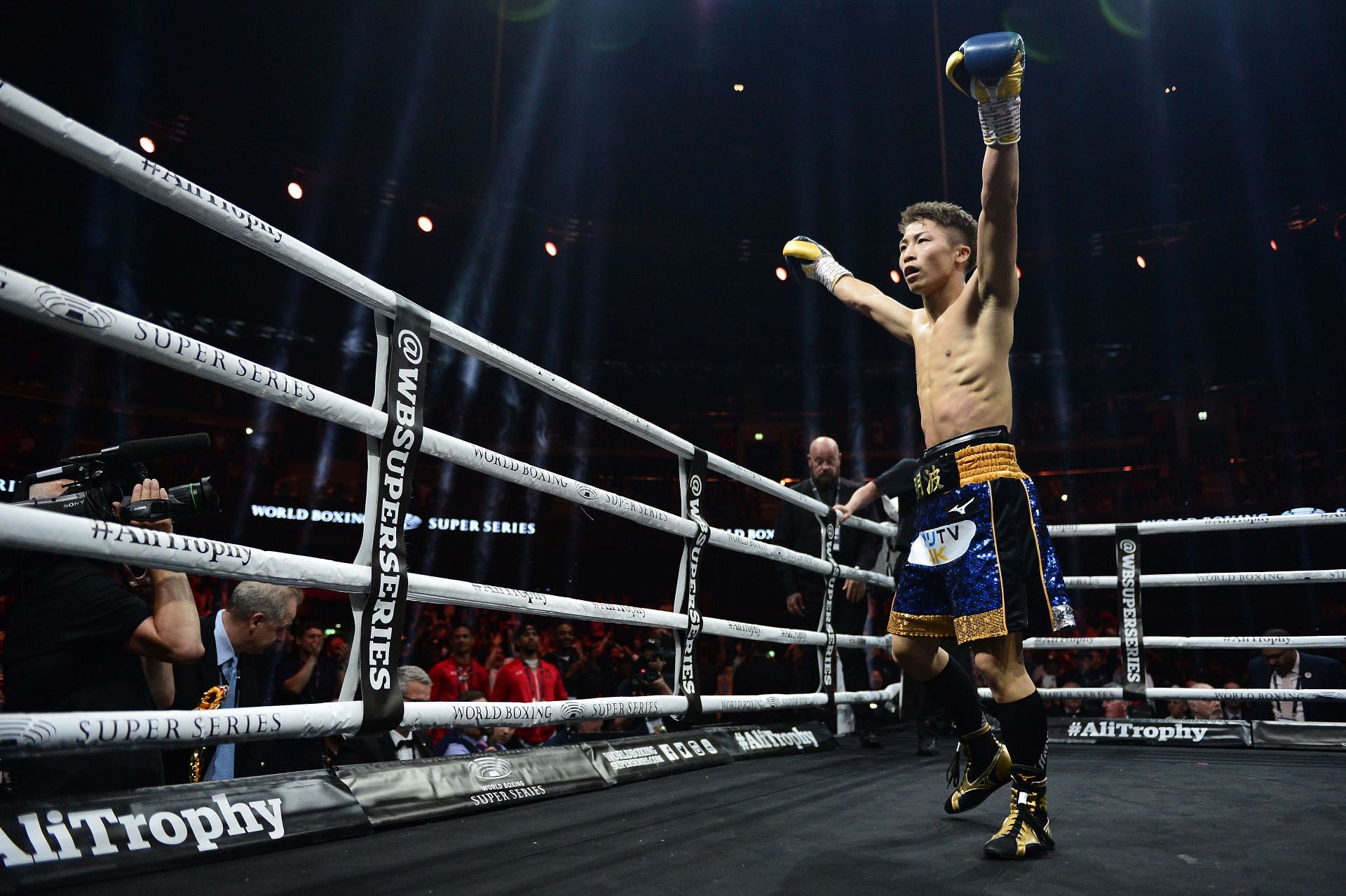 Naoya Inoue raising his arms in victory