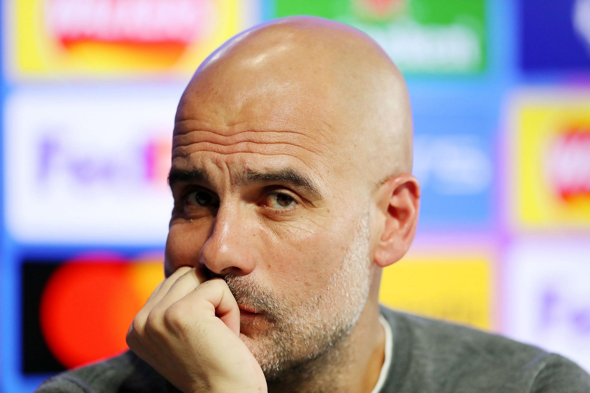 Manchester City boss Pep Guardiola looks on during a press conference