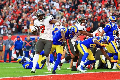 Tampa Bay Buccaneers running back Leonard Fornette runs past Jalen Ramsey and the Rams defense to score