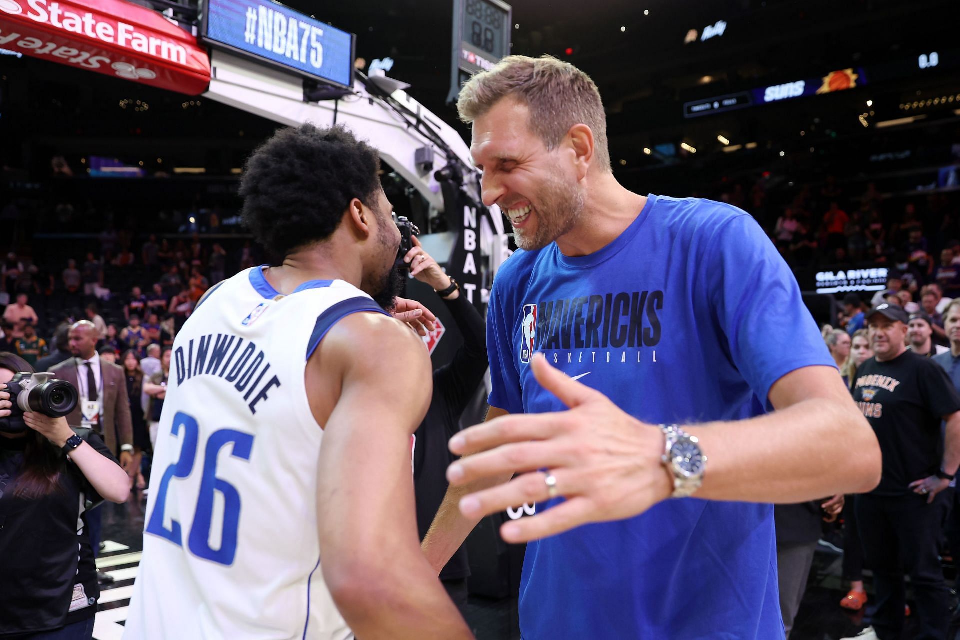 Former Dallas Mavericks player Dirk Nowitzki greets Spencer Dinwiddie after Game 7.