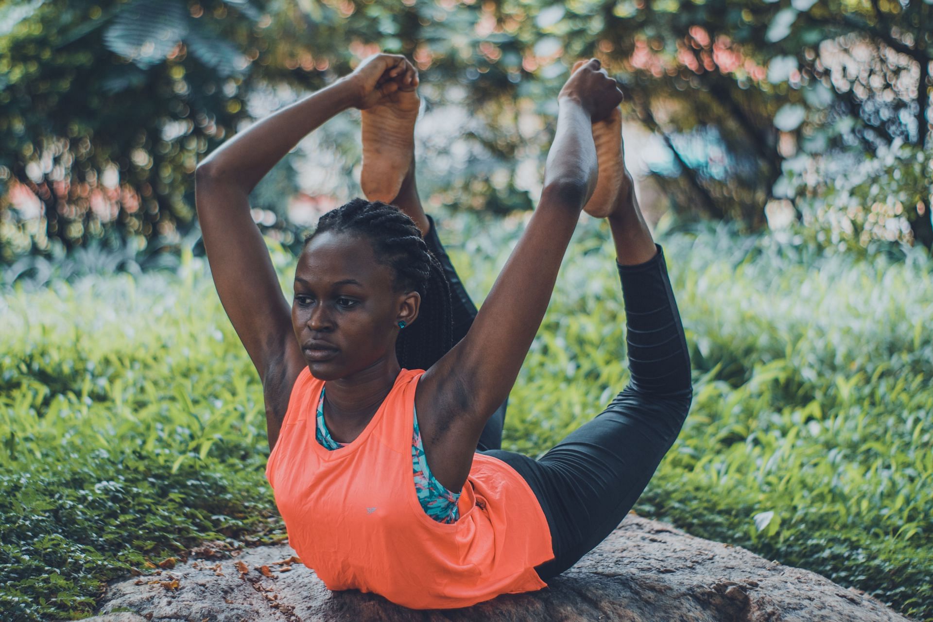 Bow pose in yoga stretches your lower back and hamstring. (Image via Pexels / Oluremi Adebayo)