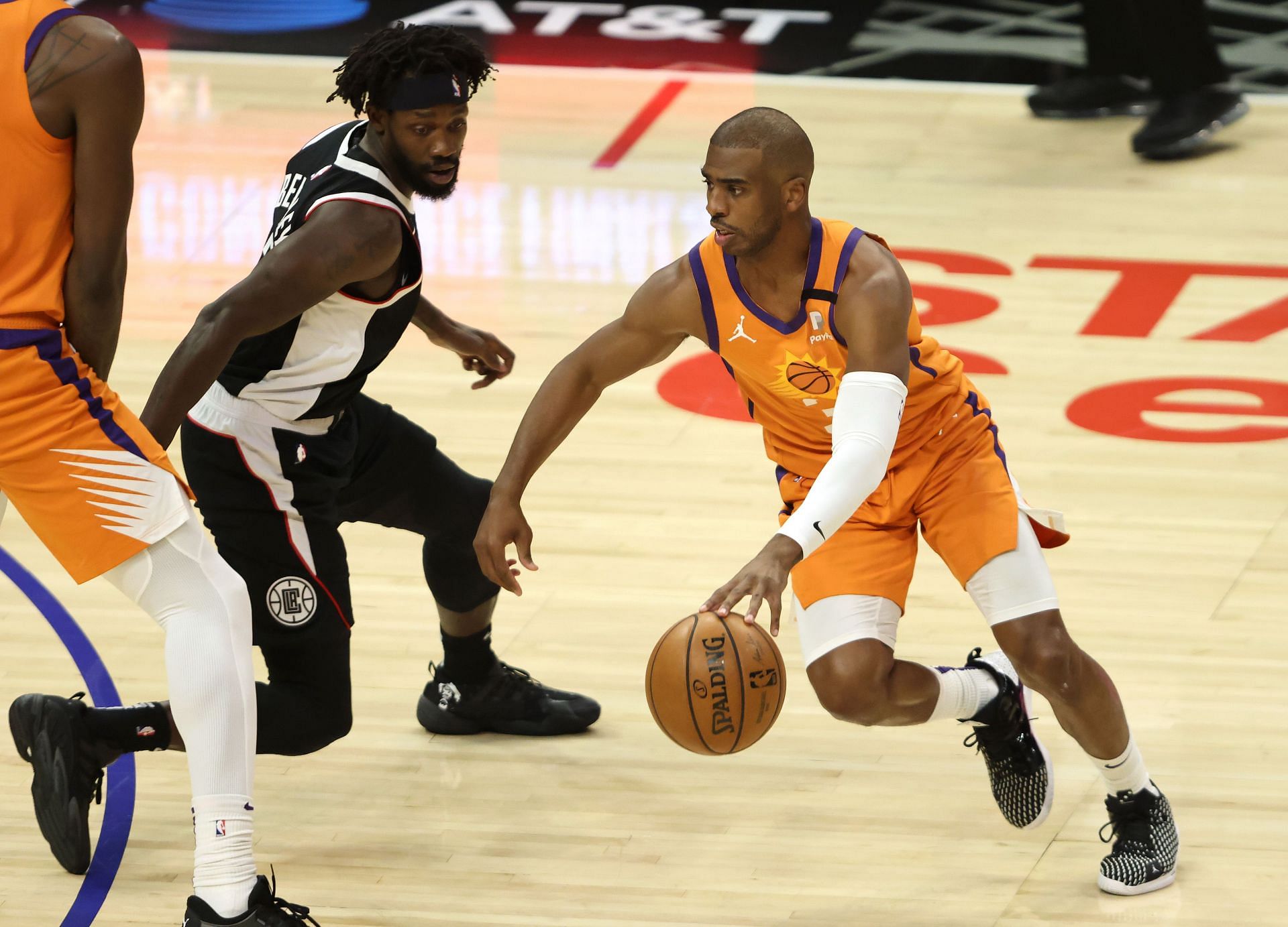 Patrick Beverley trying to guard Chris Paul.