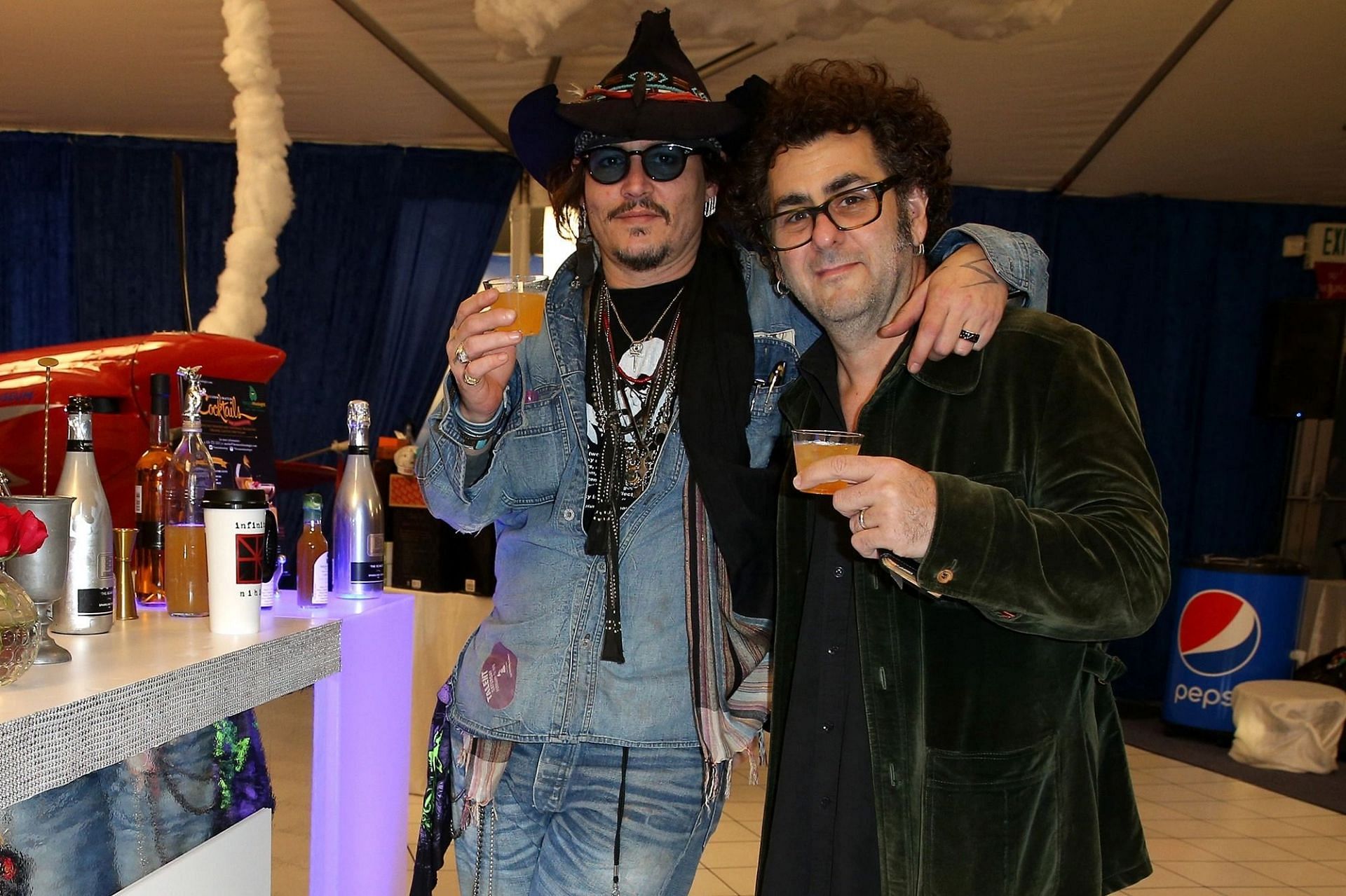 Johnny Depp and Bruce Witkin (Image via Imeh Akpanudosen/WireImage/Getty Images)