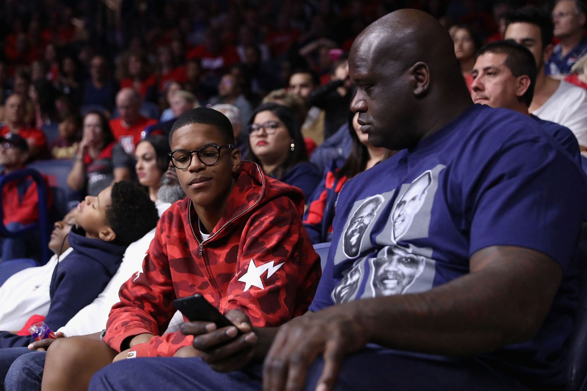 Attend NBA legend Shaquille O & # 039;  Neil (right) and his son Sheriff a college basketball game between the Arizona Wildcats and the Pioneers of the Sacred Heart at McCalley Center on November 18, 2016 in Tucson, Arizona.