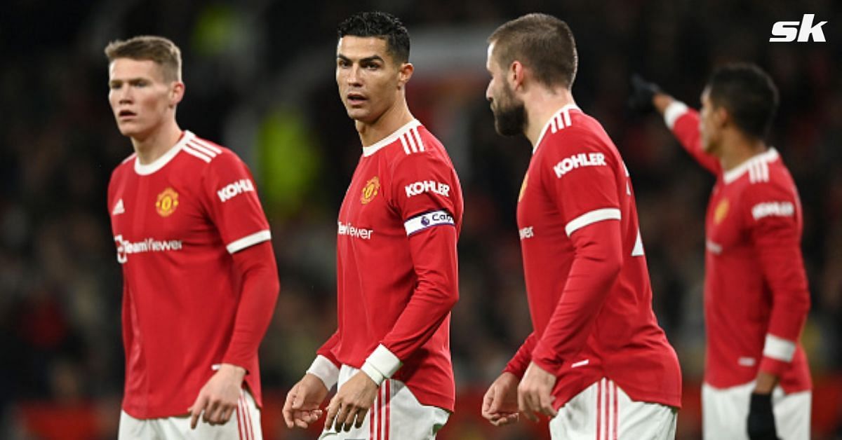 Manchester United players react during a game.