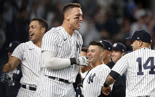 The Yankees celebrate after a come from behind walk-off home run by Aaron Judge against the Blue Jays in the ninth inning.