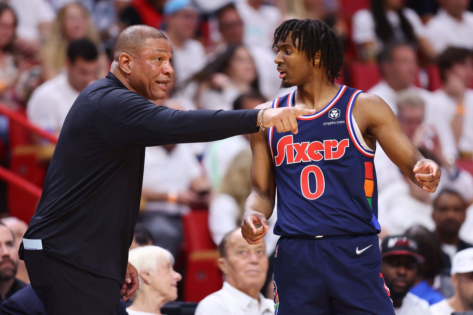 Head coach Doc Rivers talks with Tyrese Maxey against the Miami Heat.