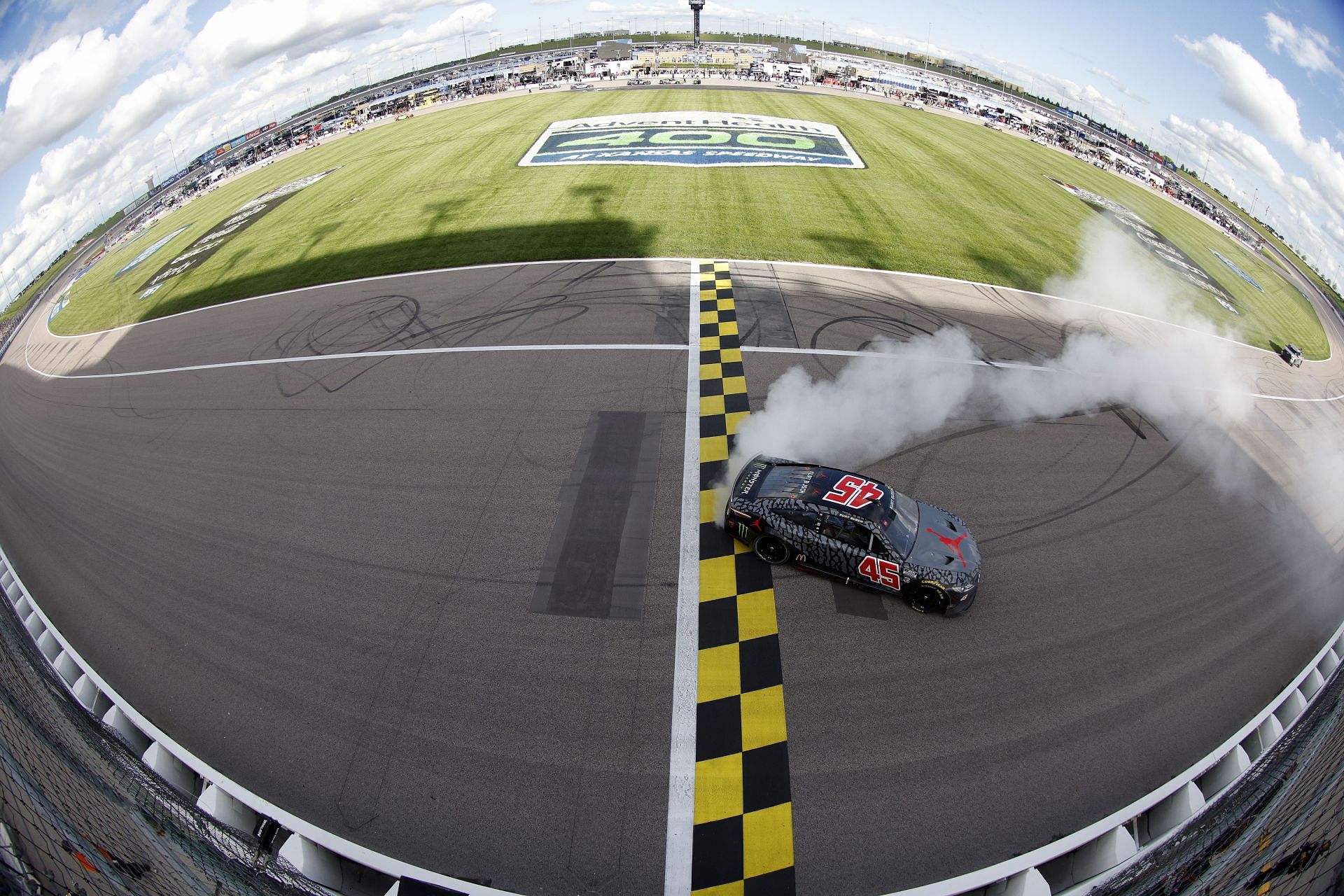 Kurt Busch celebrates with a burnout after winning the NASCAR Cup Series AdventHealth 400 at Kansas Speedway (Photo by Sean Gardner/Getty Images)