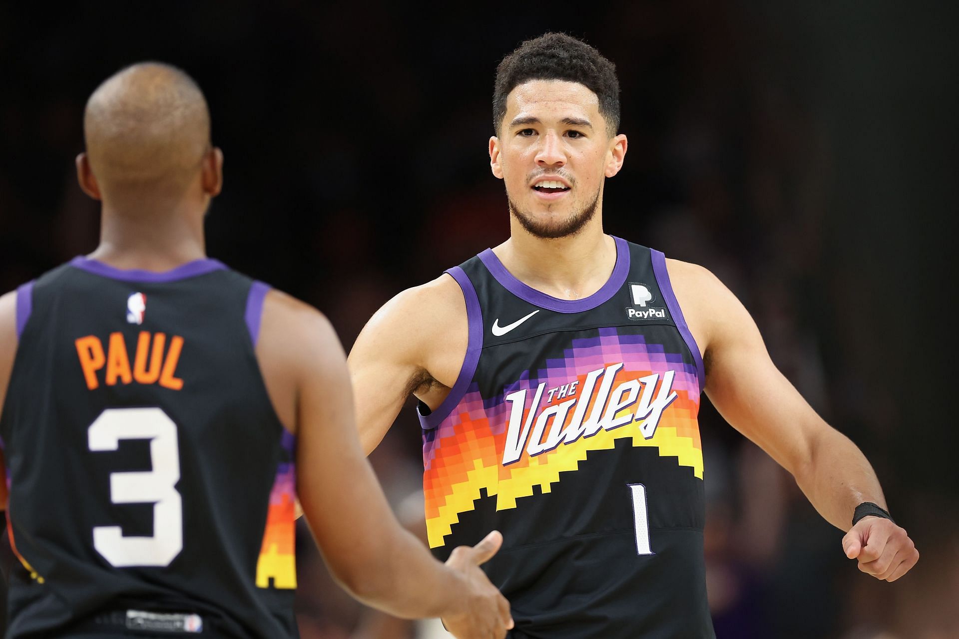 Chris Paul and Devin Booker in action for Game 1 against the Mavericks