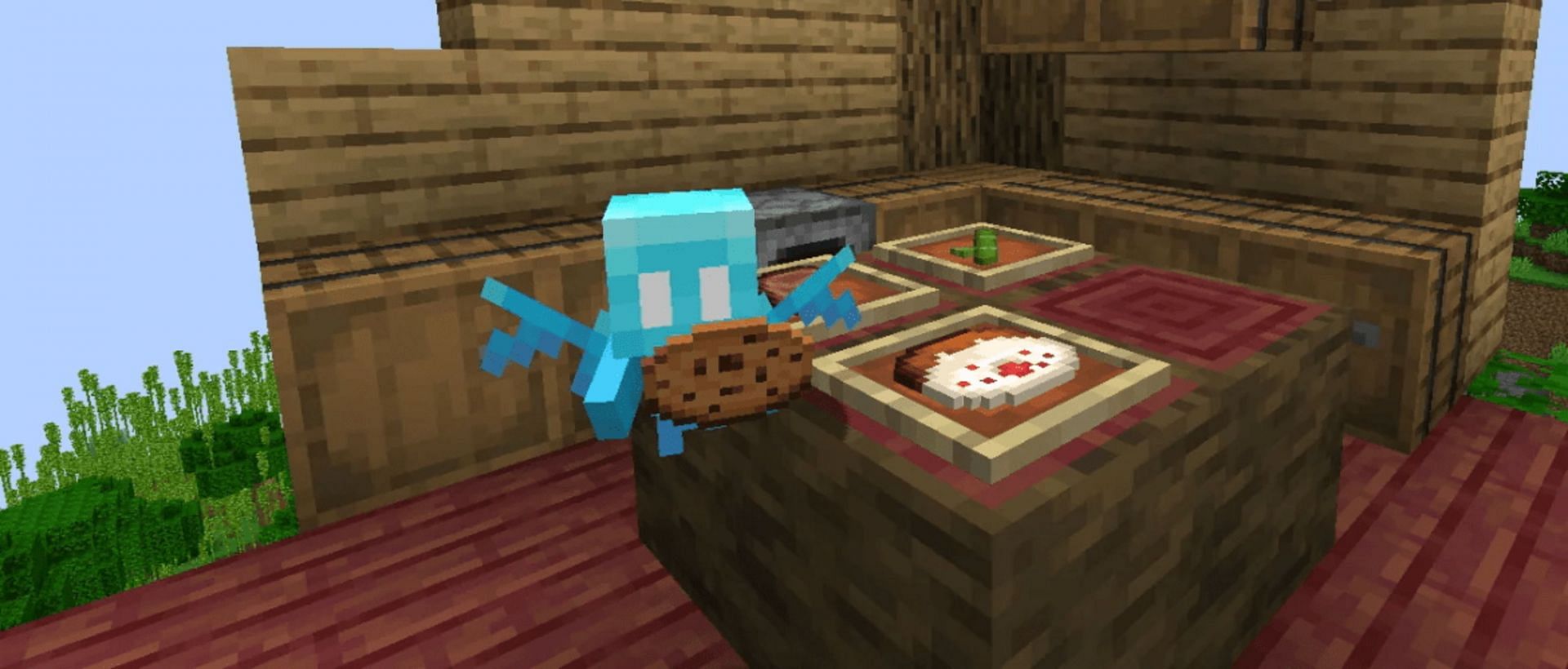 Minecraft&#039;s allay enjoying a cookie (Image via Mojang)