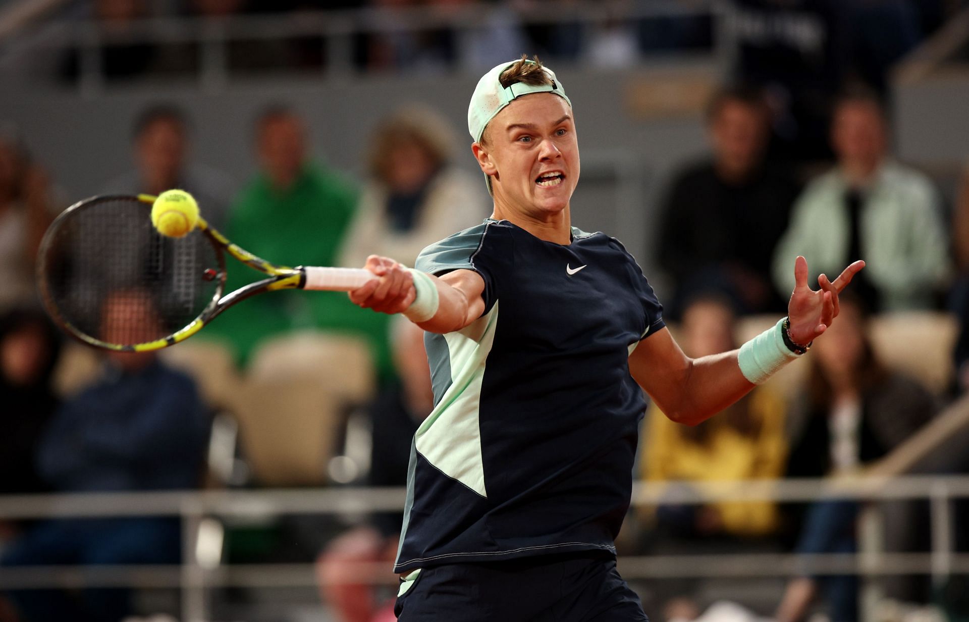 Holger Rune plays a forehand at the French Open