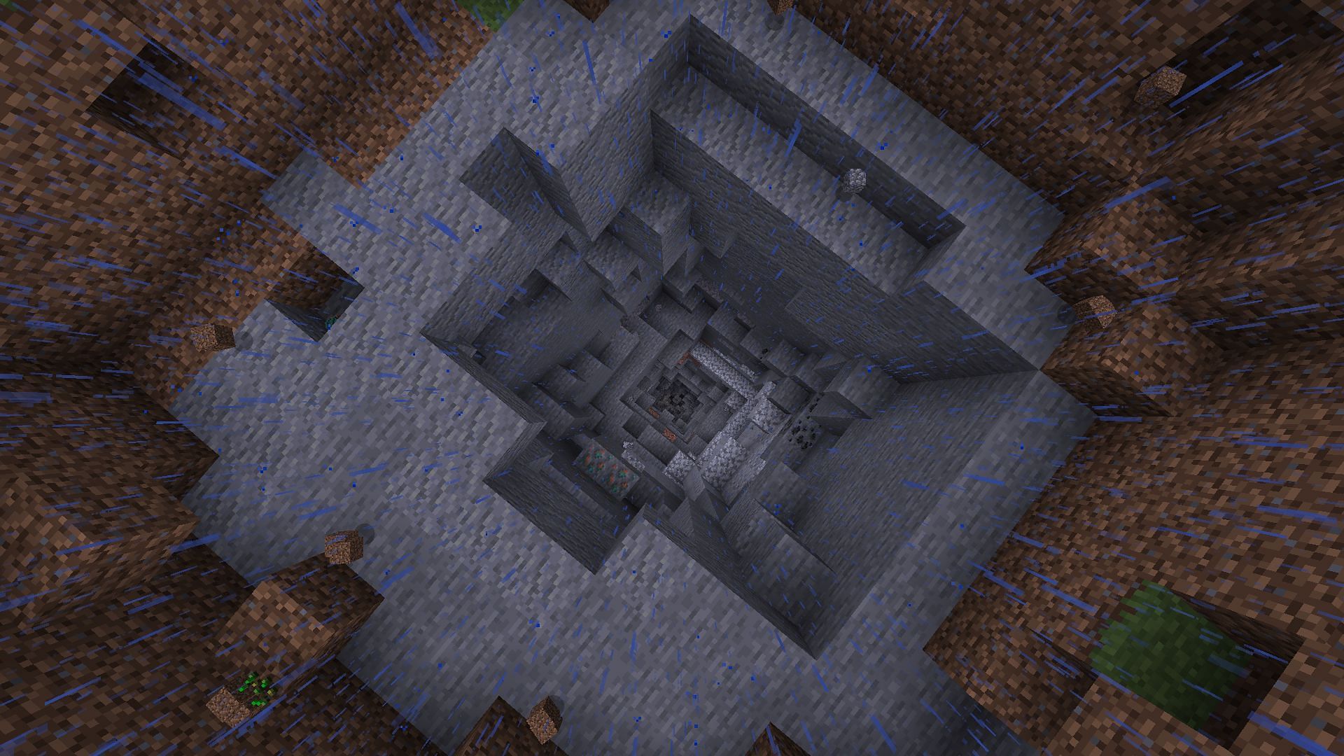A tunnel carved all the way down to bedrock using TNT (Image via Minecraft)