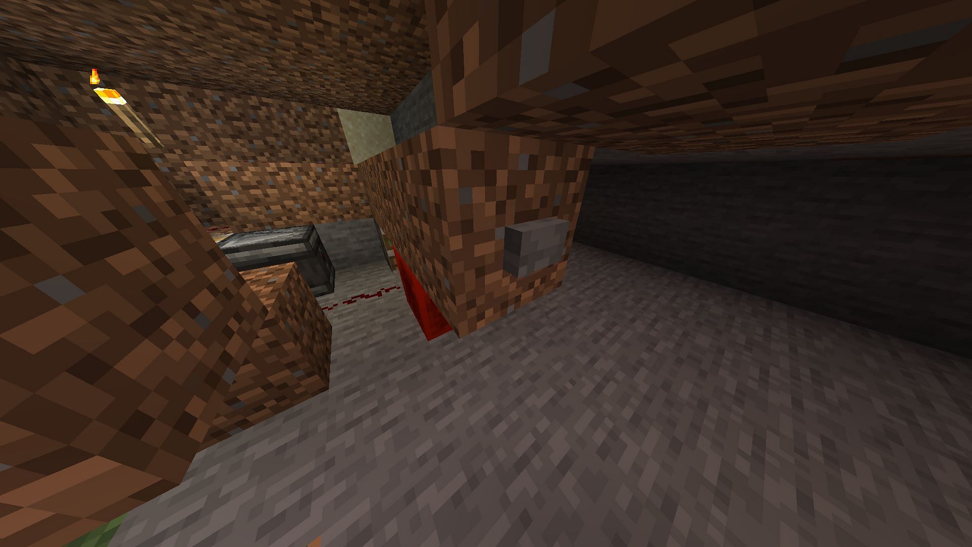 Button going to the first sticky piston in the key room (Image via Minecraft)