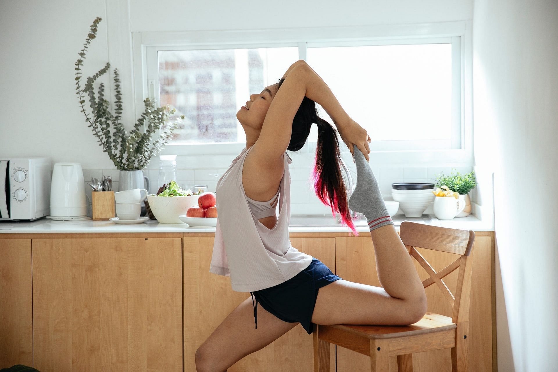 Chair yoga is a convenient and easy way to perform different yoga poses. (Photo by Miriam Alonso via pexels)