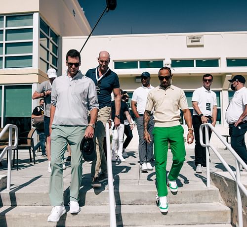 The pair walking down to play a round of golf together