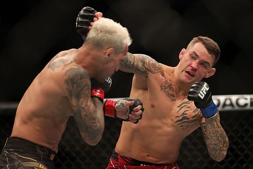 Dustin Poirier in action against Charles Oliveira at UFC 269