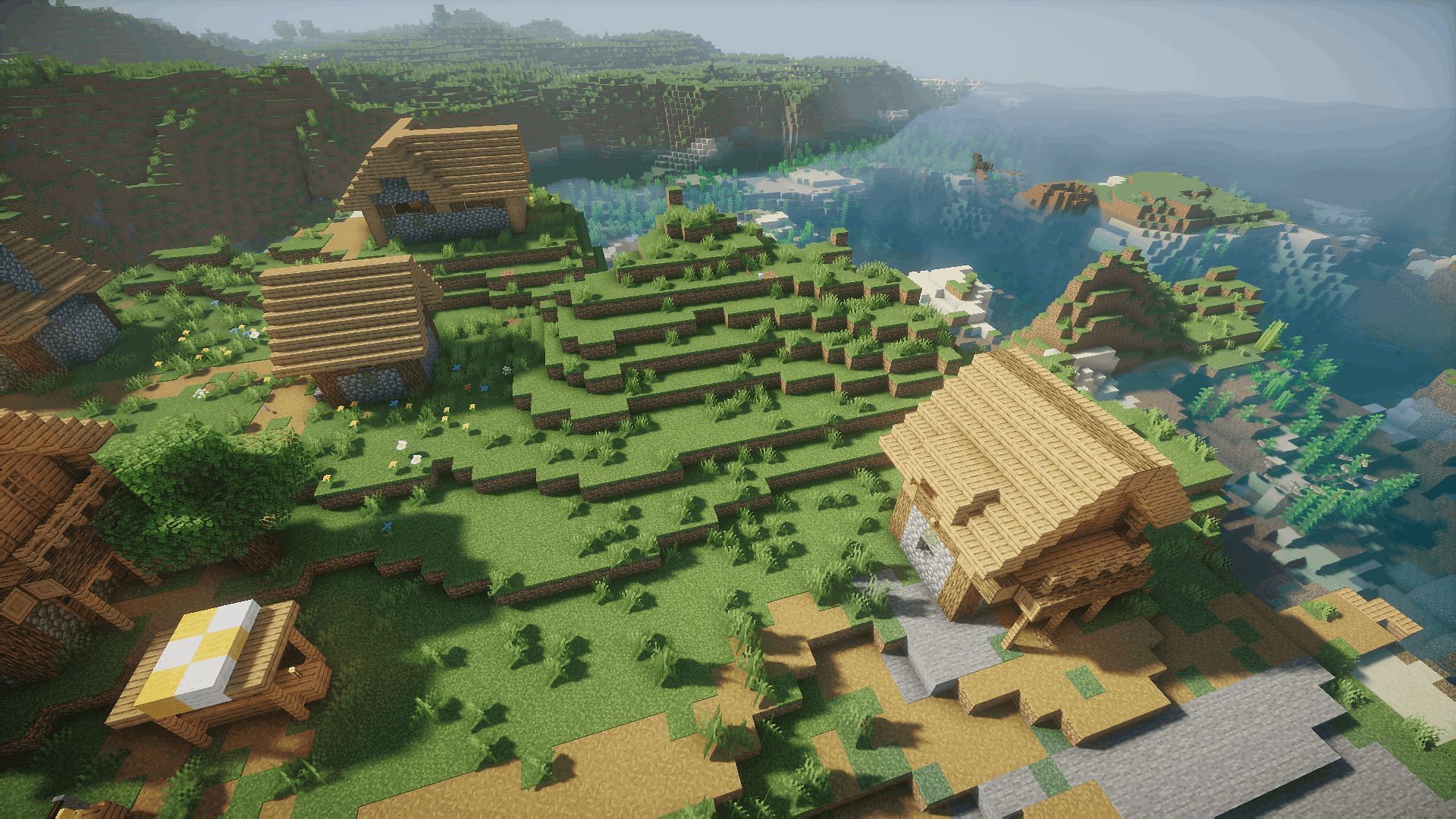 A coastal village with the Nostalgia shader (Image via Minecraft)