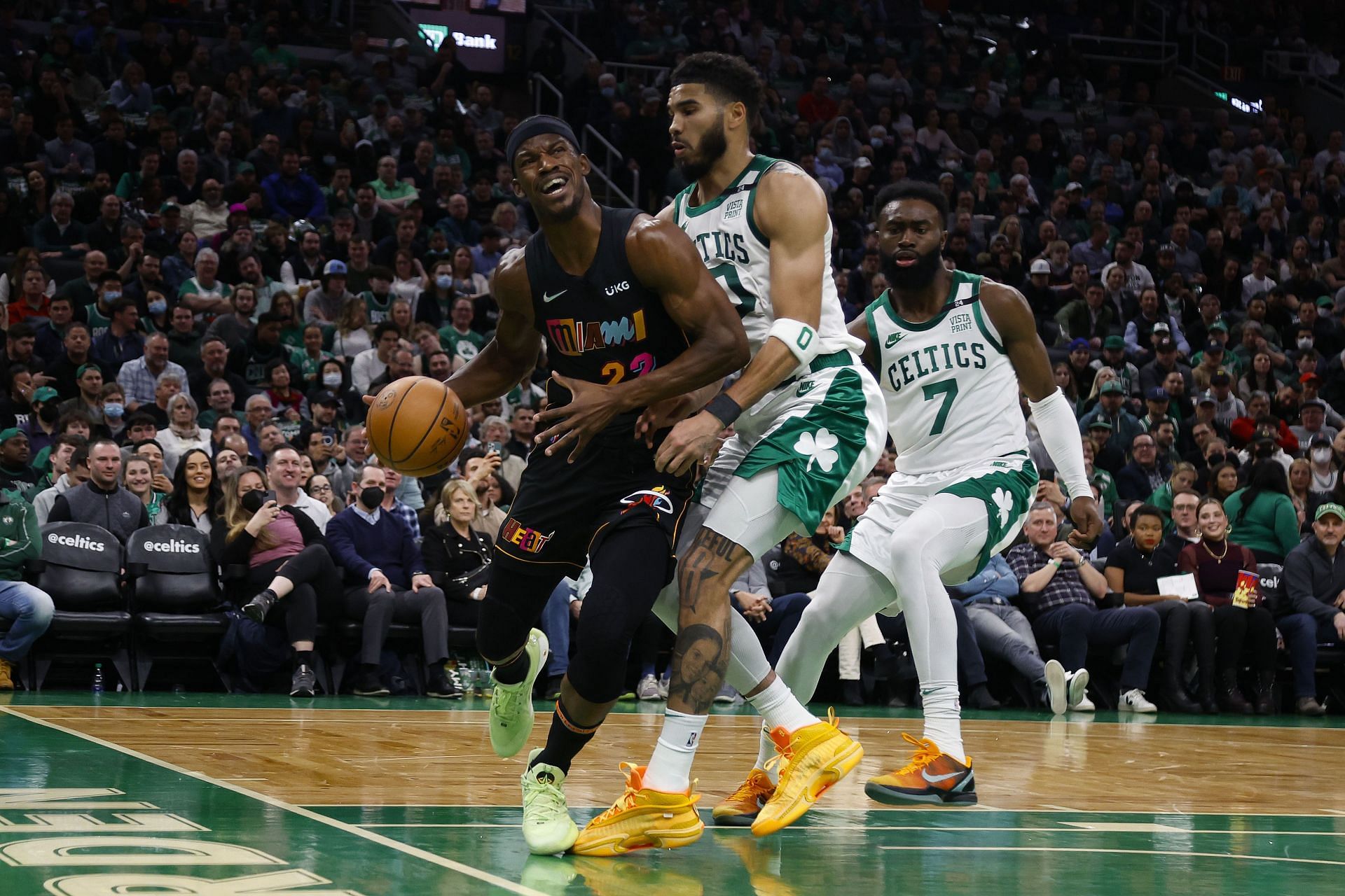 Jimmy Butler #22 of the Miami Heat is run into by Jayson Tatum #0 of the Boston Celtics