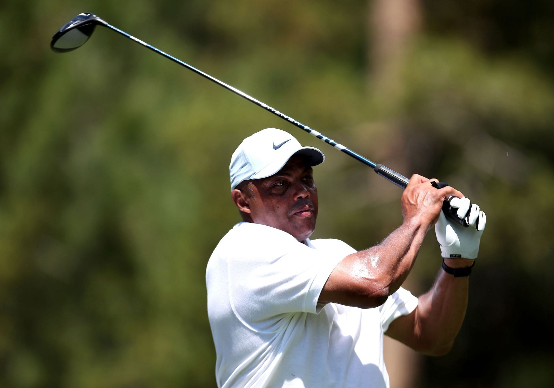 Former NBA player Charles Barkley taking a swing