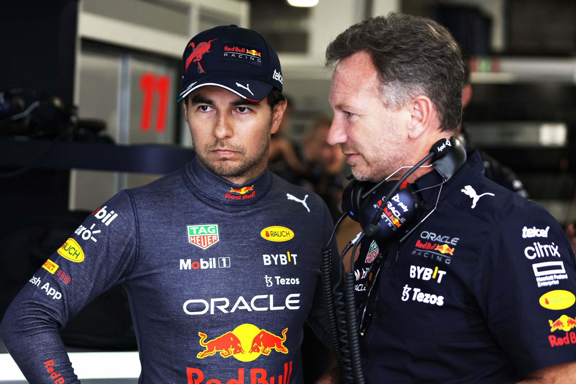 Red Bull driver Sergio Perez (left) and team principal Chrsitian Horner speak after the 2022 F1 Spanish GP. (Photo by Mark Thompson/Getty Images)