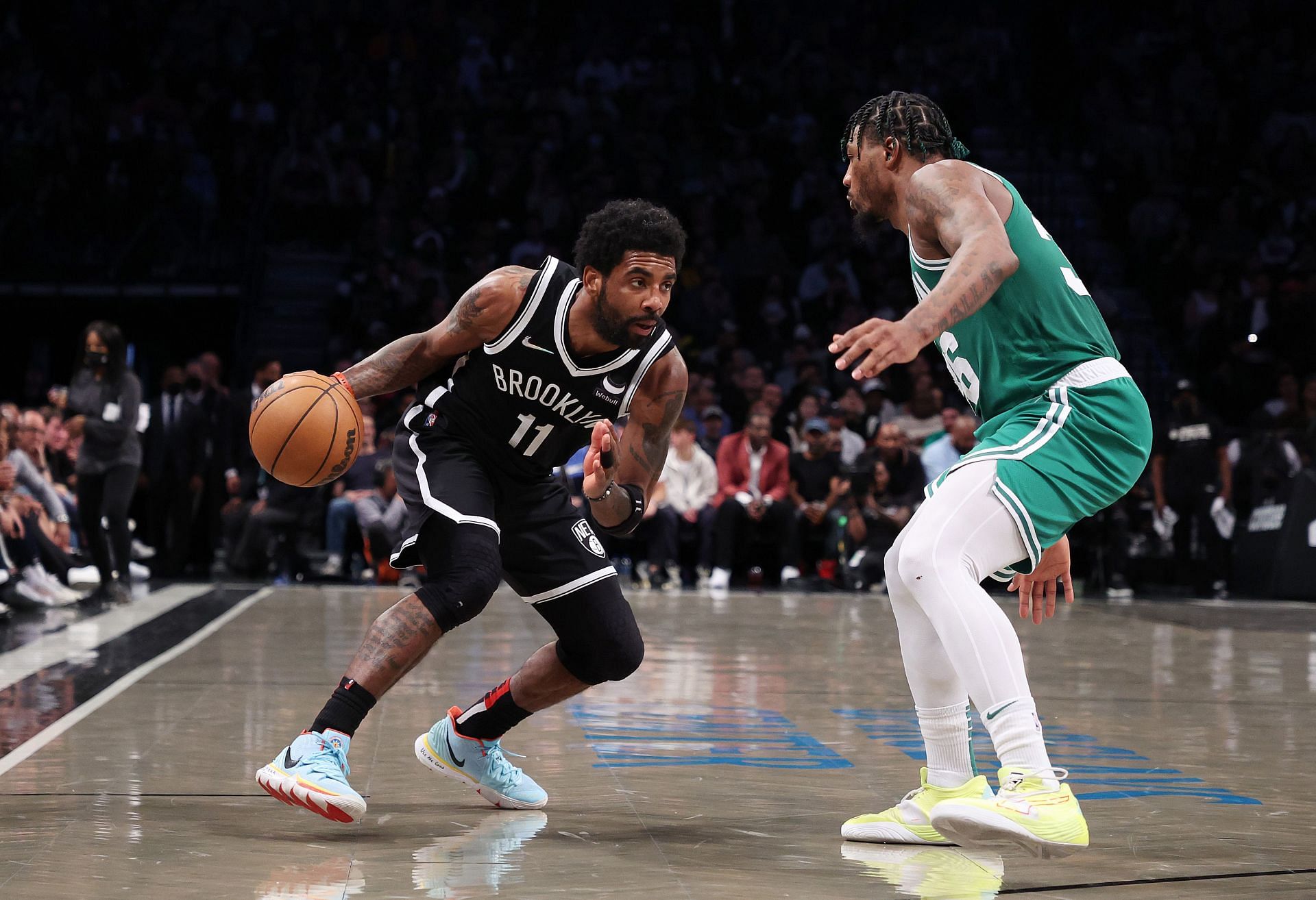 Kyrie Irving #11 of the Brooklyn Nets drives against Marcus Smart #36 of the Boston Celtics