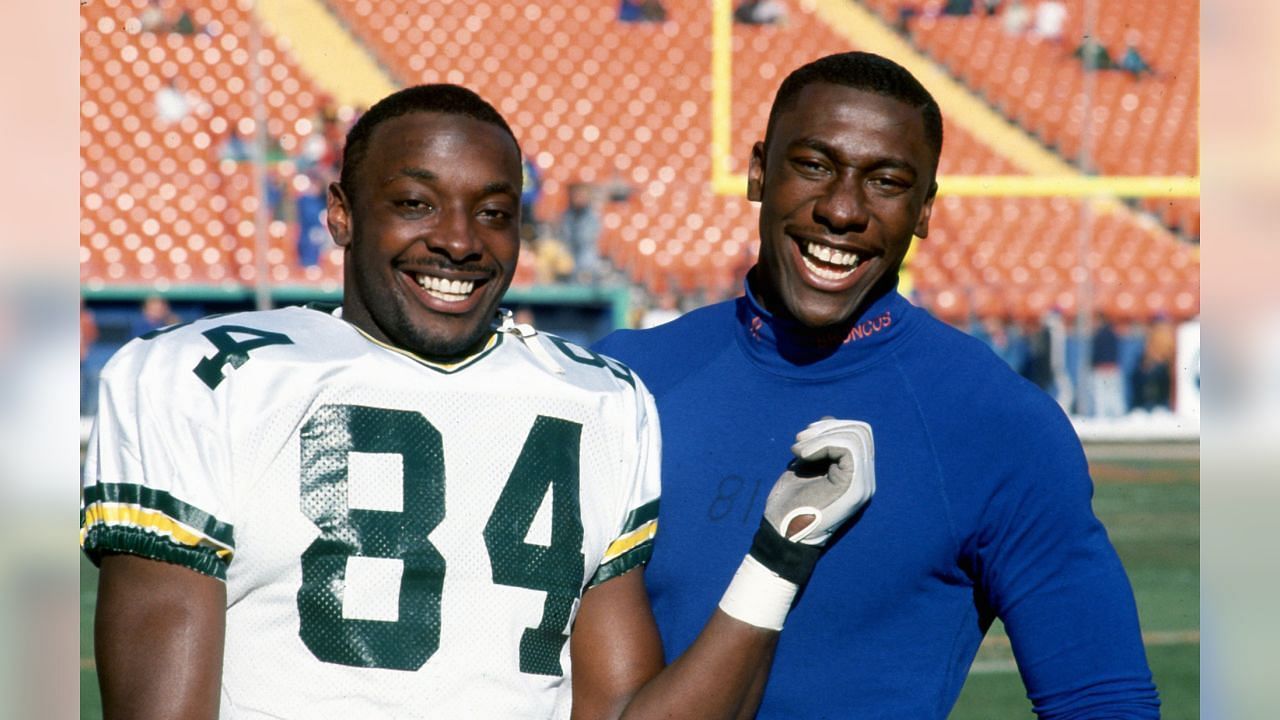 Sterling Sharpe (#84) with the Packers standing with his younger brother Shannon Sharpe. Source: Denver Broncos