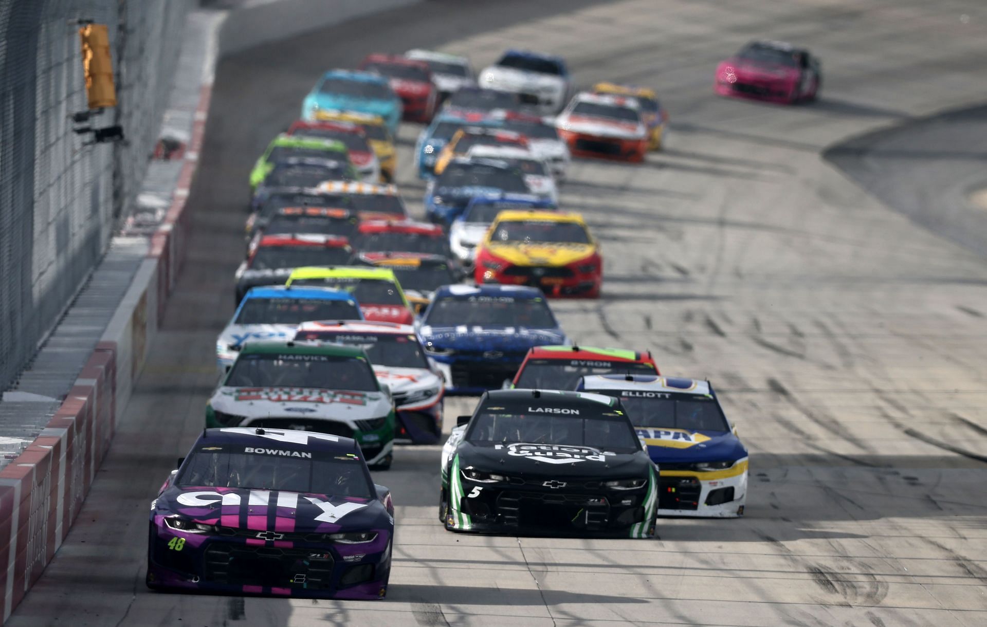 Alex Bowman leads the field during the NASCAR Cup Series Drydene 400 at Dover International Speedway