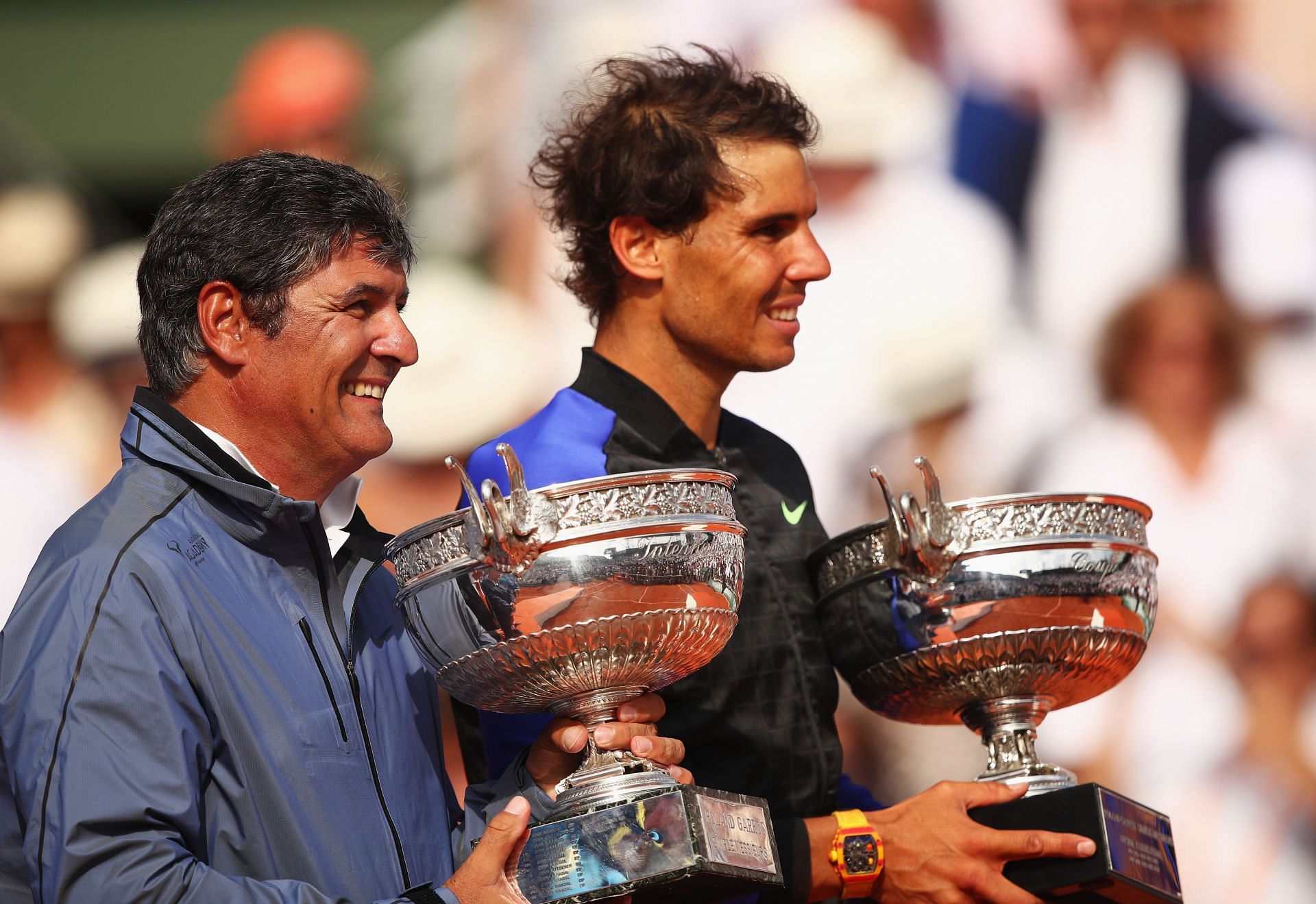 Toni and Rafael Nadal pose alongside the 2017 French Open trophy